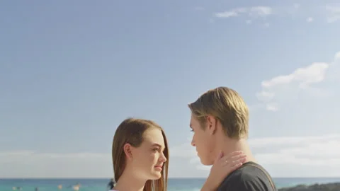 Young beautiful couple looking at each other happily in love laughing with sky i Video stock 199458073