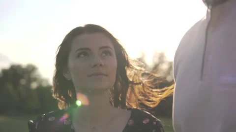 Young beautiful couple on sunset background Stock Footage 112247757