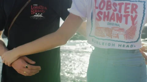 Young beautiful couple walking and holding each other happily in love with sky a Stock Footage 199455153