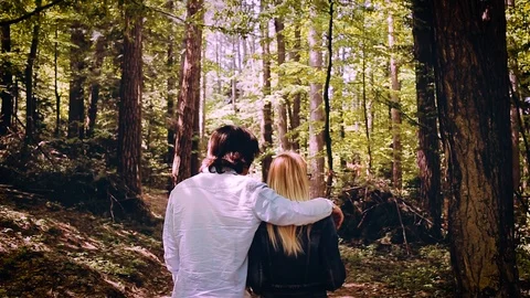 Young Beautiful Couple Walking Through Forest Video stock 89894147
