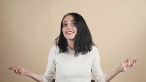 A young beautiful cute brunette oops, Oh, accidentally, not guilty  emotions Stock Footage 85279252