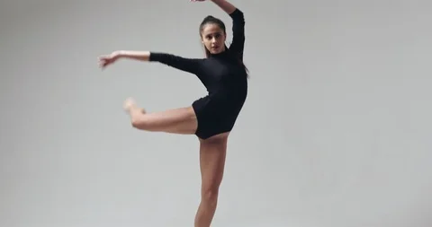 Young beautiful dancer is dancing and posing in the studio. Slow motion. Stock Footage 88128811