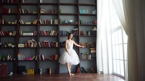 Young beautiful dancer posing on a studio background Stock Footage 59336640