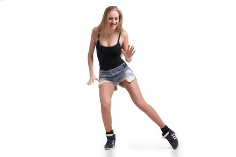Young beautiful dancer posing on studio background Stock Photos