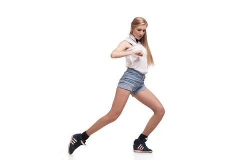 Young beautiful dancer posing on studio background Foto stock