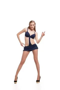 Young beautiful dancer posing on studio background Stock Photos