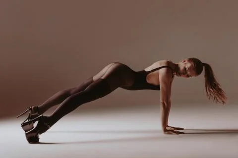 Young beautiful dancer is posing in studio Stock Photos