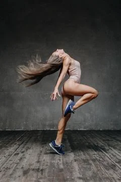 Young beautiful dancer is posing in studio Stock Photos