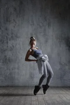 Young beautiful dancer is posing in studio Stock Photos