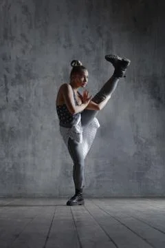 Young beautiful dancer is posing in studio Stock Photos