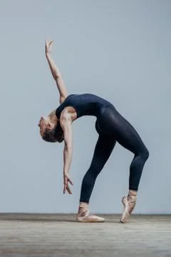 Young beautiful dancer is posing in studio Stock Photos