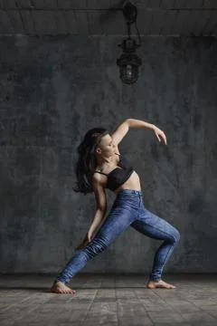 Young beautiful dancer is posing in studio Stock Photos
