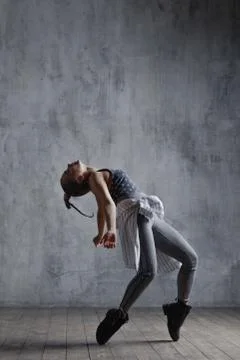 Young beautiful dancer is posing in studio Stock Photos