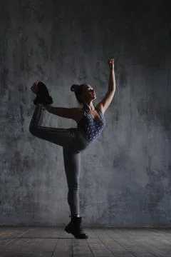 Young beautiful dancer is posing in studio Stock Photos