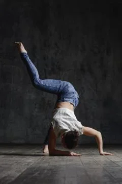Young beautiful dancer is posing in studio Stock Photos