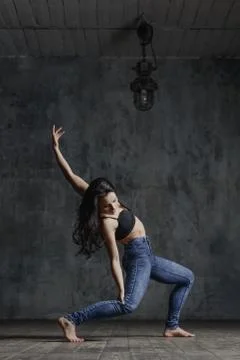 Young beautiful dancer is posing in studio Stock Photos