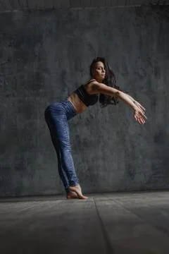 Young beautiful dancer is posing in studio Stock Photos