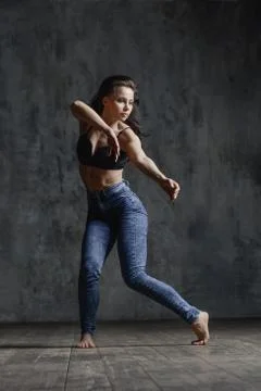 Young beautiful dancer is posing in studio Stock Photos
