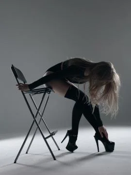 Young beautiful dancer is posing in studio Stock Photos