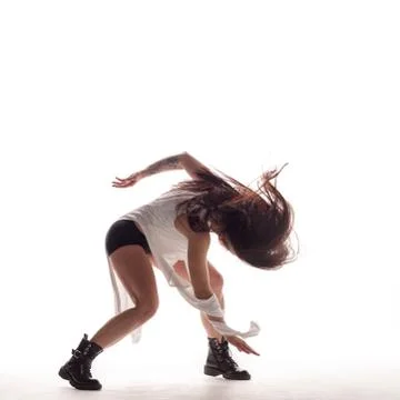 Young beautiful dancer is posing in studio Stock Photos