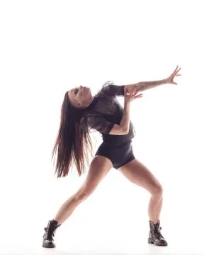 Young beautiful dancer is posing in studio Stock Photos