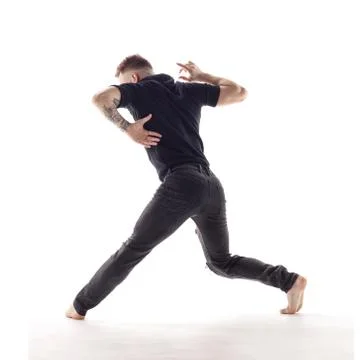 Young beautiful dancer is posing in studio Stock Photos