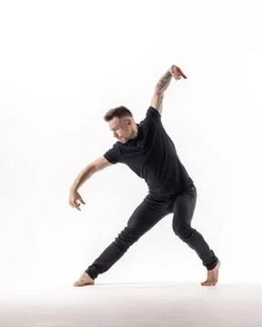 Young beautiful dancer is posing in studio Stock Photos