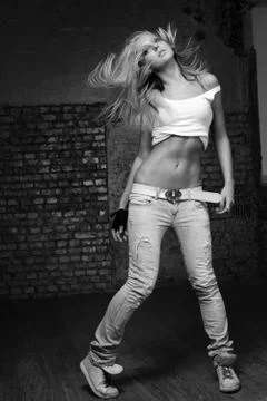 Young beautiful dancer posing in studio Stock Photos