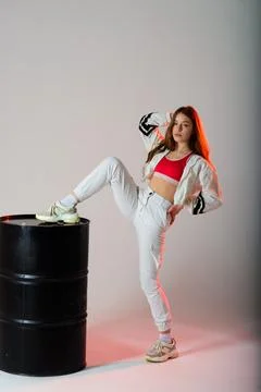 Young beautiful dancer posing on a studio background Stock Photos