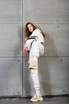 Young beautiful dancer posing on a studio background Stock Photos
