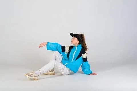 Young beautiful dancer posing on a studio background Stock Photos