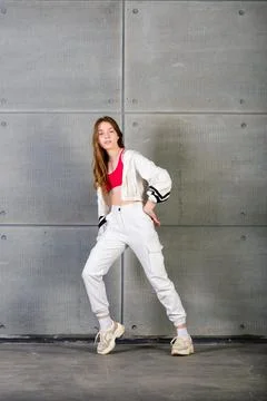 Young beautiful dancer posing on a studio background Stock Photos