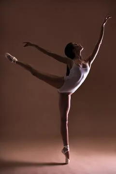 Young beautiful dancer posing on toes Photos