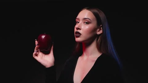 Young beautiful girl eats an apple. Healthy food and lifestyle concept. Stock Footage 288583234