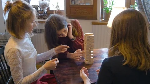 Young beautiful girl playing a board game Stock Footage