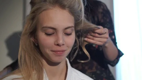 Young beautiful girl talking during styling Видео 72371663