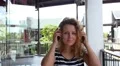 Young Beautiful Girl Walking and Listening Music in Earphones Outdoors. HD Footage