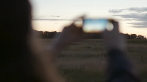 Young Beautiful Hipster Girl Is Taking Photos Of Sunset On Phone. Close Up View  Stock Footage 89944522