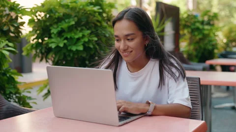 Young beautiful hispanic woman using laptop sitting on table at coffee shop t Stock Footage 220153855