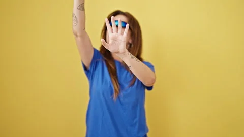 Young beautiful hispanic woman using virtual reality glasses playing over i.. Stock Footage 247380106