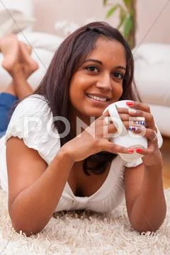 Young beautiful indian woman drinking coffee Stock Photos