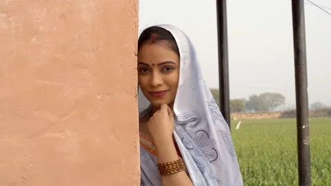 Young beautiful lady smiling while looking into the camera - traditional clot... Stock Footage 134856959