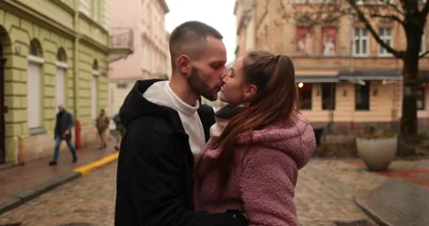 A young, beautiful, loving couple walking on a gloomy autumn day Stock Footage 247486980