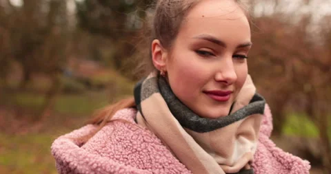 A young, beautiful, loving couple walking on a gloomy autumn day Stock Footage 247488533