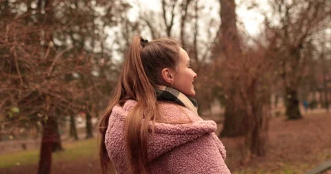 A young, beautiful, loving couple walking on a gloomy autumn day Stock Footage 247488663