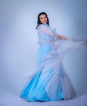 Young beautiful model in the image of princesse ,cinderella dressed in a blue Stock Photos