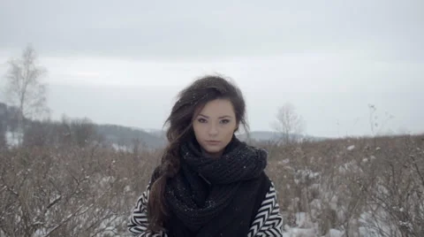 Young beautiful model posing over winter meadow. 動画素材 61020986