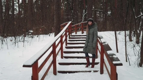 Young beautiful model posing over winter forest. Stylish fashion portrait. wood Stock Footage 73670039