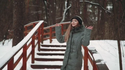 Young beautiful model posing over winter forest. Stylish fashion portrait. wood Stock Footage 73670282