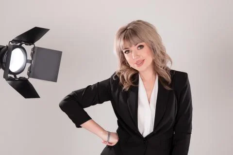 Young beautiful model posing in professionally equipped studio Stock Photos